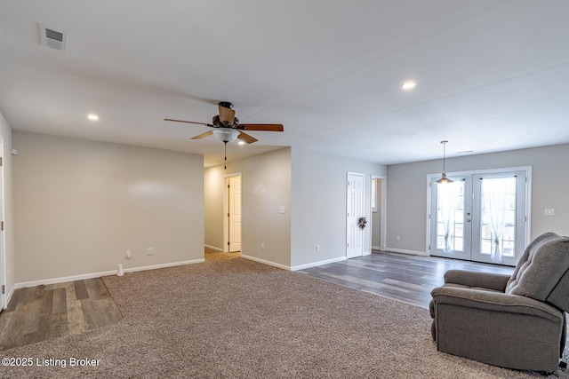 carpeted living room with baseboards, ceiling fan, visible vents, and recessed lighting