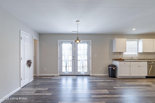 kitchen with dishwasher, dark wood-type flooring, and a healthy amount of sunlight