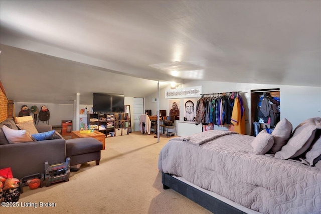 carpeted bedroom featuring vaulted ceiling