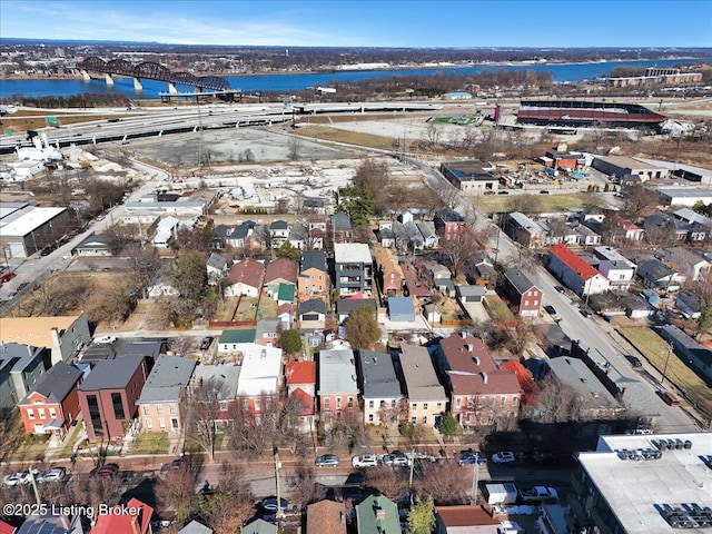 drone / aerial view with a water view and a residential view