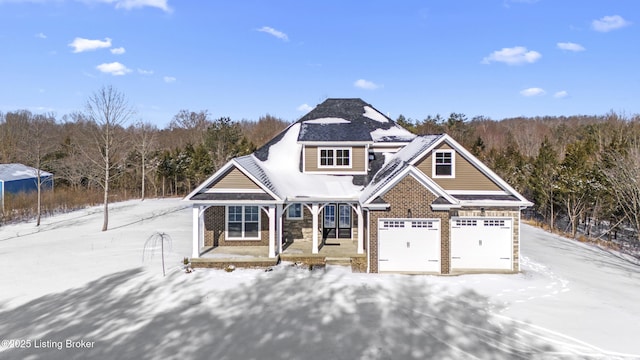 view of front facade with a garage and brick siding