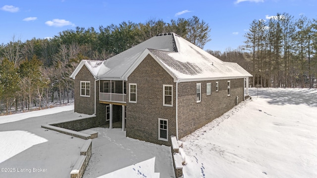 view of property exterior with brick siding