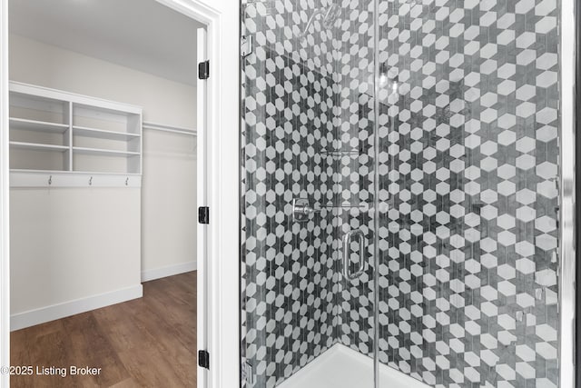 spacious closet featuring dark wood-style floors