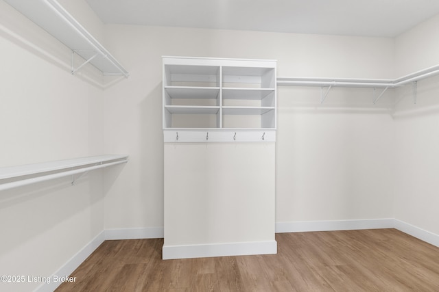 spacious closet with wood finished floors