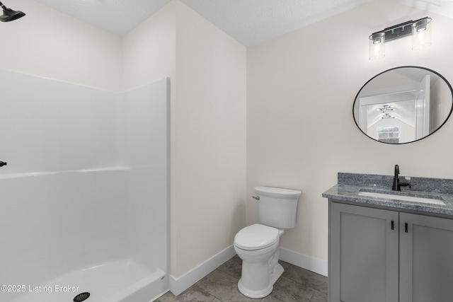 bathroom featuring a stall shower, baseboards, toilet, tile patterned floors, and vanity