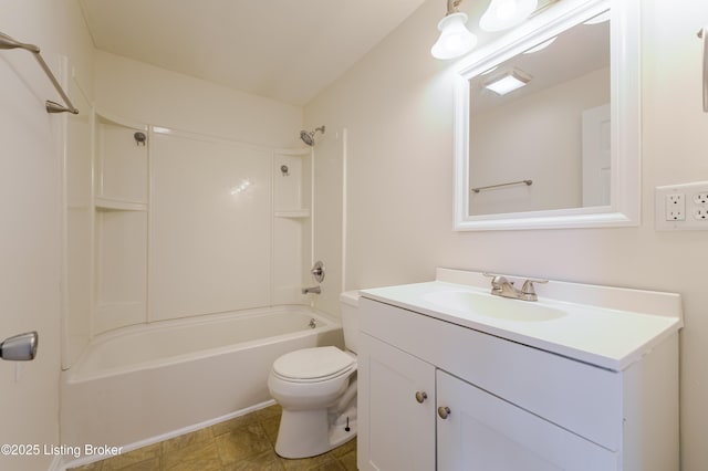 bathroom with shower / washtub combination, toilet, and vanity