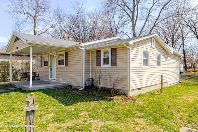 exterior space featuring a yard and crawl space