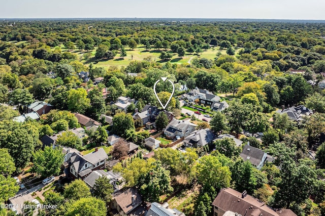 aerial view with a residential view and a wooded view