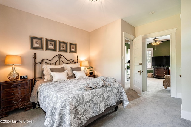 carpeted bedroom featuring baseboards