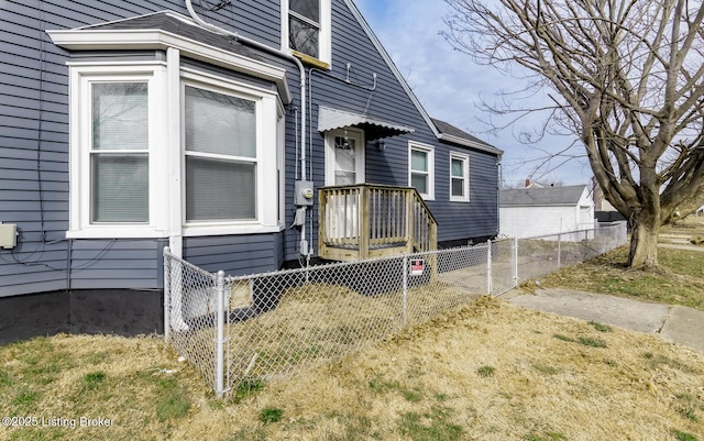 view of home's exterior featuring fence