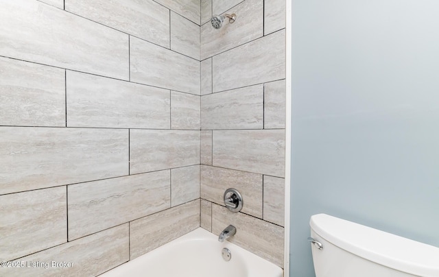 bathroom with shower / washtub combination and toilet