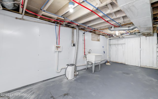 unfinished basement featuring a sink