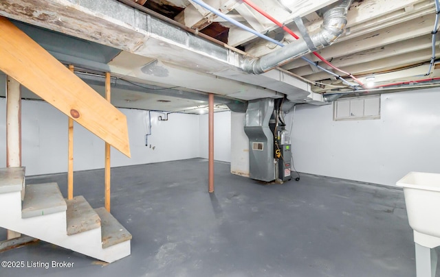 unfinished basement featuring heating unit