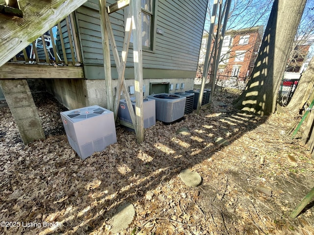 exterior details with central AC and fence