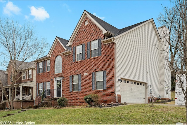 view of front of property with a front yard, concrete driveway, brick siding, and an attached garage