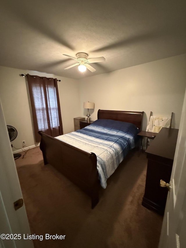 bedroom with a ceiling fan and carpet flooring