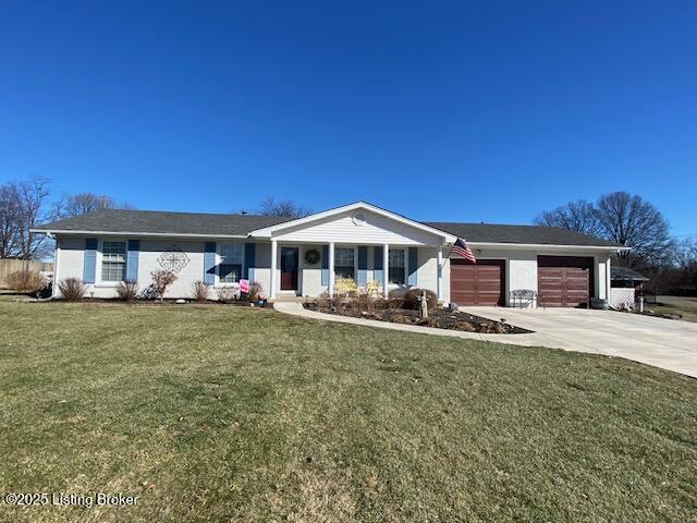 ranch-style house with an attached garage, driveway, and a front lawn