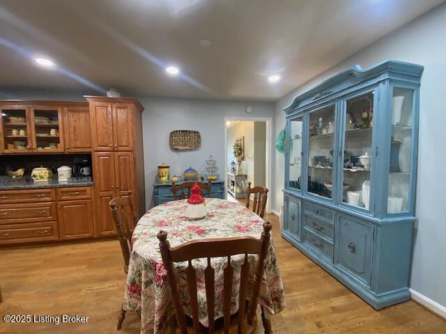 dining space with recessed lighting and light wood finished floors