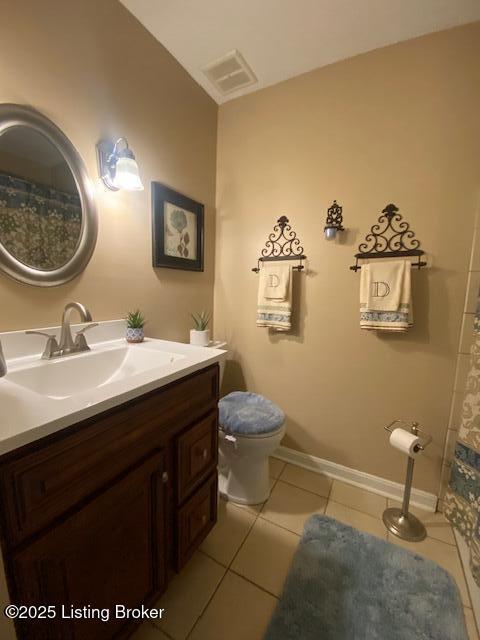 full bath with visible vents, toilet, vanity, tile patterned flooring, and baseboards