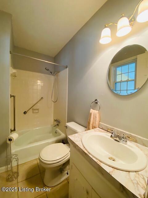 bathroom with shower / bath combination, vanity, tile patterned floors, and toilet