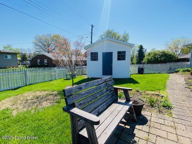 view of shed with a fenced backyard