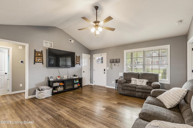 living room featuring ceiling fan, wood finished floors, visible vents, baseboards, and vaulted ceiling