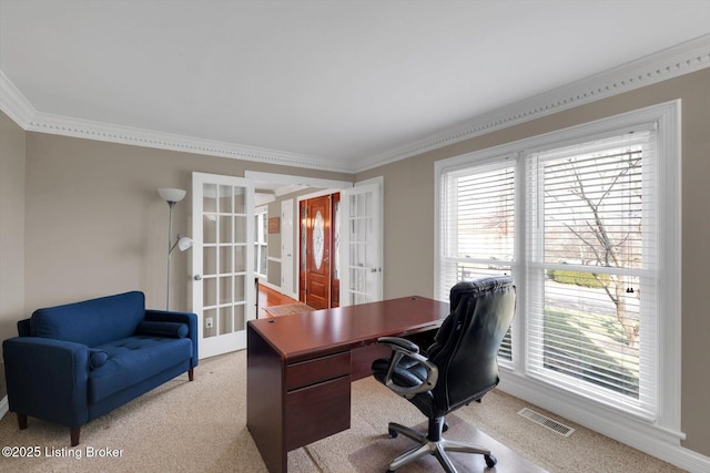 office area featuring crown molding, french doors, visible vents, and light colored carpet