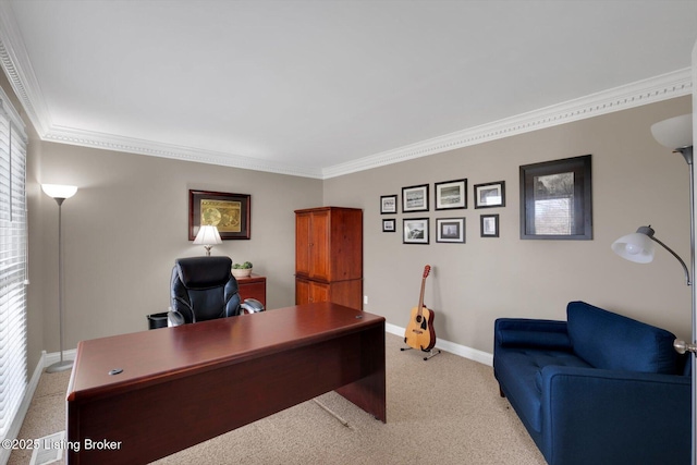 office area with ornamental molding, light colored carpet, and baseboards