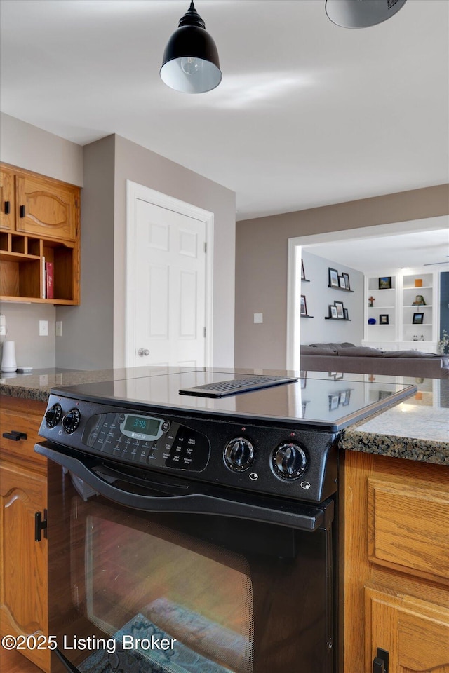 kitchen with brown cabinetry and black range with electric cooktop