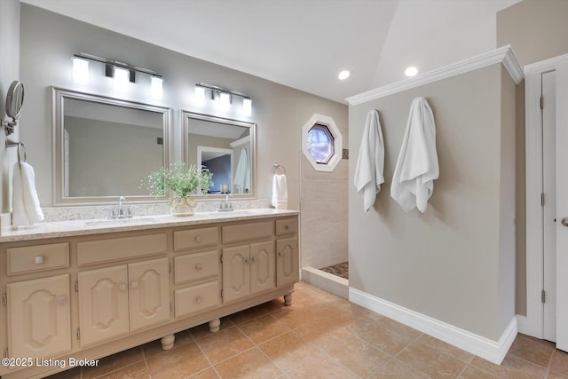 bathroom featuring double vanity, vaulted ceiling, walk in shower, and a sink