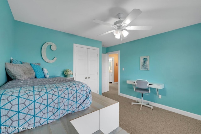 bedroom featuring ceiling fan, carpet floors, a closet, and baseboards