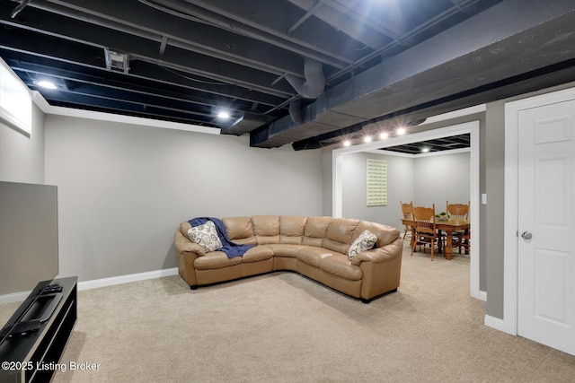 living area with carpet, visible vents, and baseboards