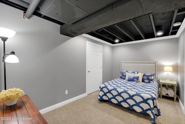 bedroom featuring carpet flooring and baseboards