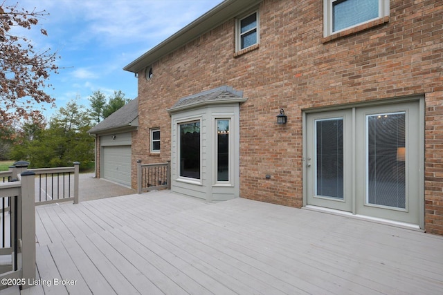 wooden terrace with a garage