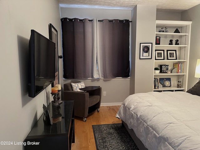 bedroom with light wood-style flooring