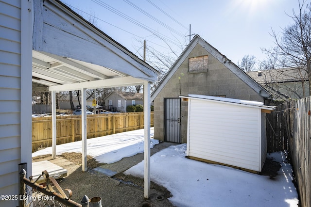 exterior space featuring a shed and fence