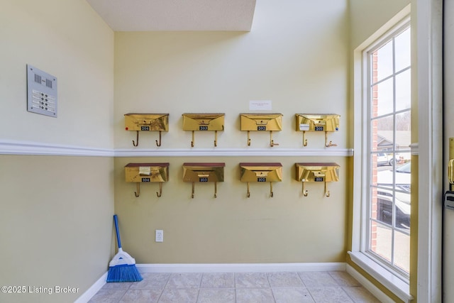 interior space featuring a wealth of natural light and baseboards