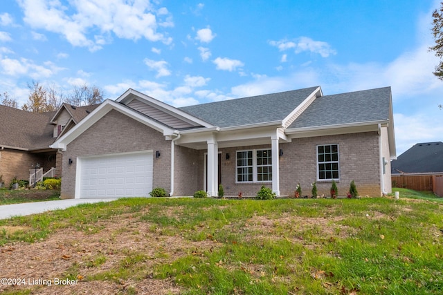 ranch-style house with a garage, concrete driveway, brick siding, and roof with shingles