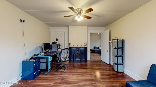 office with baseboards, a ceiling fan, and wood finished floors