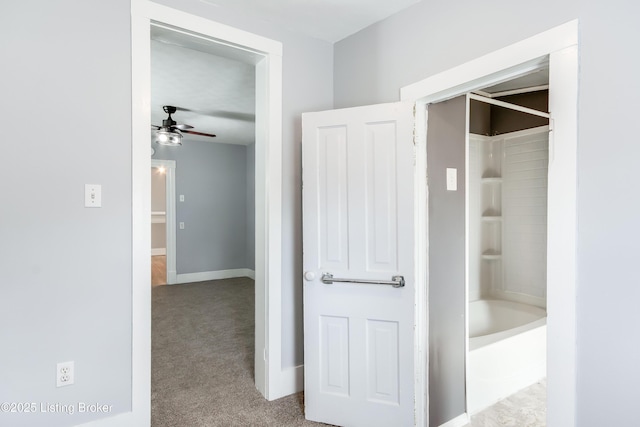 full bath with ceiling fan, tub / shower combination, and baseboards