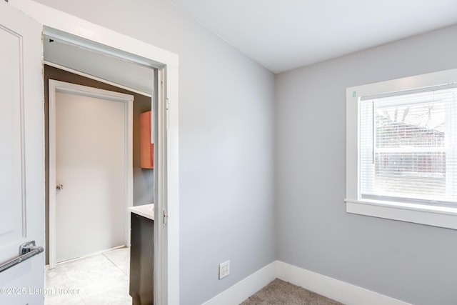 interior space featuring baseboards