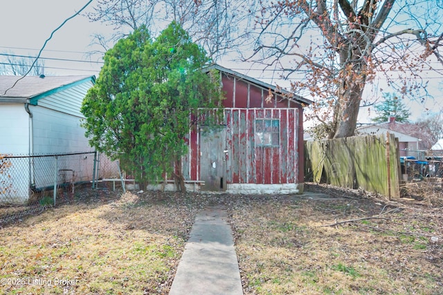 view of outbuilding with an outdoor structure and fence