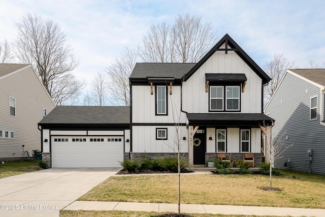 modern inspired farmhouse featuring board and batten siding, stone siding, covered porch, and a garage