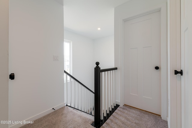 staircase featuring carpet floors, recessed lighting, and baseboards