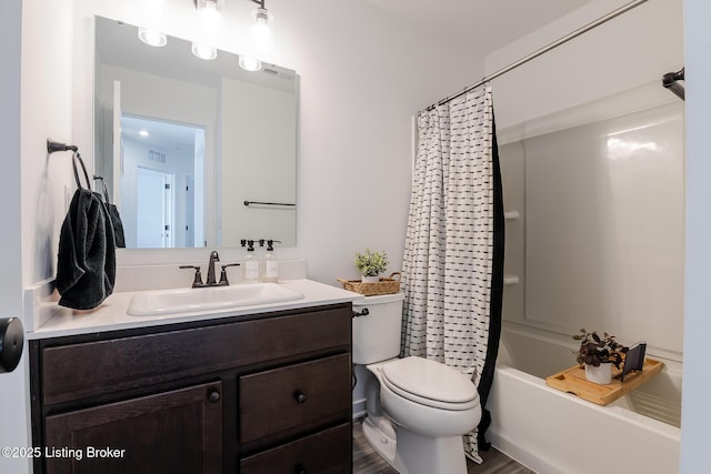 full bath featuring toilet, visible vents, vanity, and shower / bathtub combination with curtain