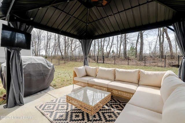 view of patio featuring an outdoor hangout area, area for grilling, a fenced backyard, and a ceiling fan