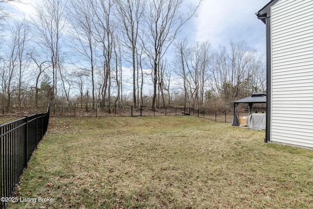 view of yard featuring a gazebo and a fenced backyard