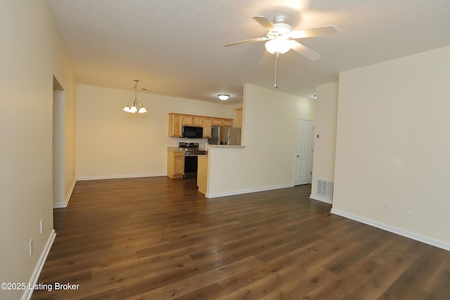 unfurnished living room featuring ceiling fan with notable chandelier, dark wood-type flooring, visible vents, and baseboards