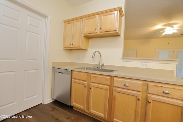 kitchen with light countertops, light brown cabinets, a sink, and stainless steel dishwasher