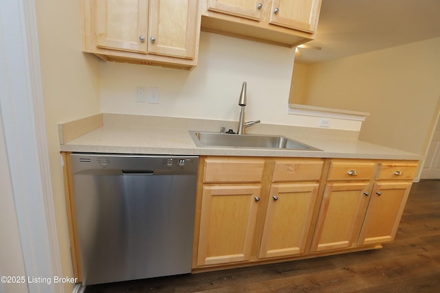 kitchen with light brown cabinets, dark wood-style flooring, a sink, light countertops, and dishwasher